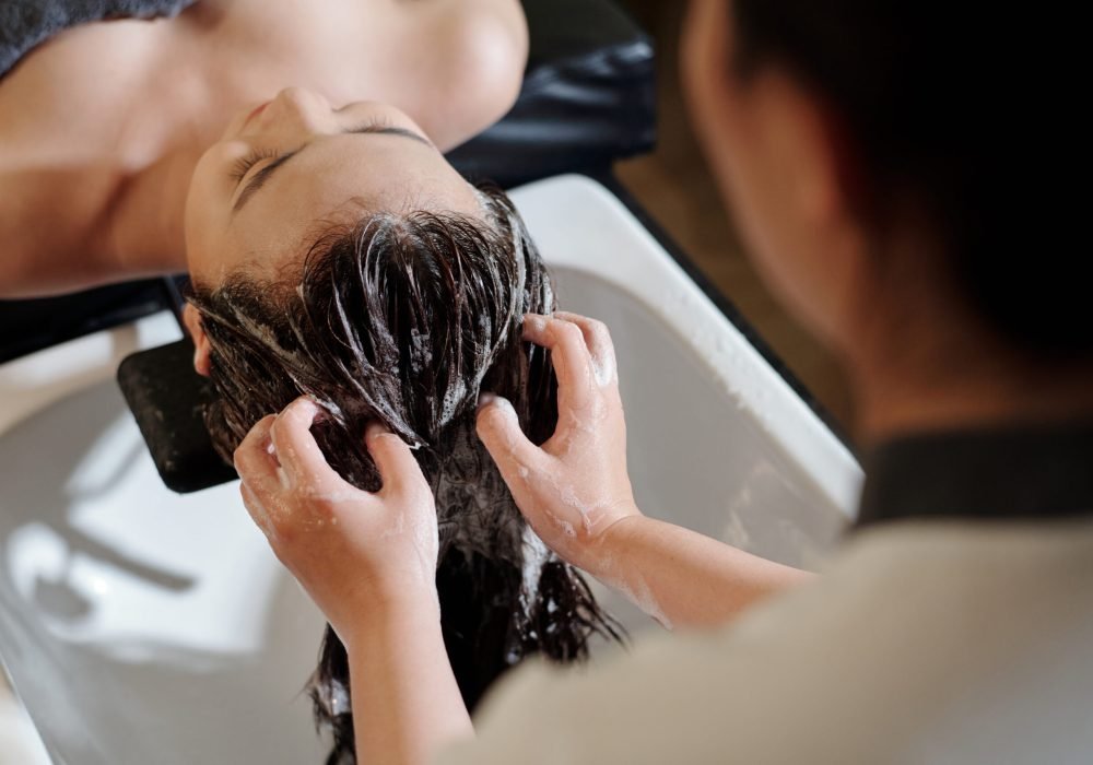 Young woman getting deep cleanse procedure in beauty salon